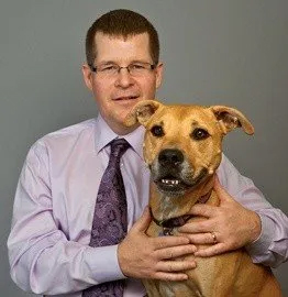 Dr. Matt Morrison employee portrait with dog